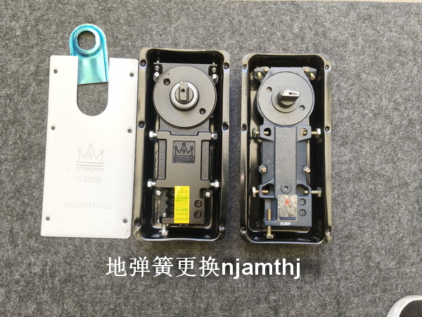 玻璃门地弹簧更换
